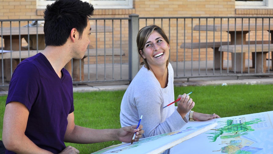 painting drawing students smiling